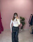 PANTALONE IN PELLE CON BOTTONI